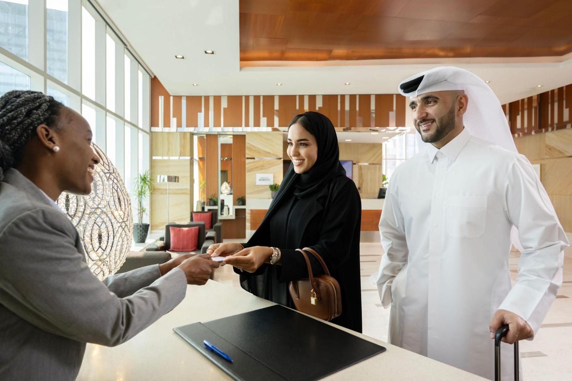 Delta Hotels By Marriott City Center Doha Exterior photo A hotel receptionist welcomes guests
